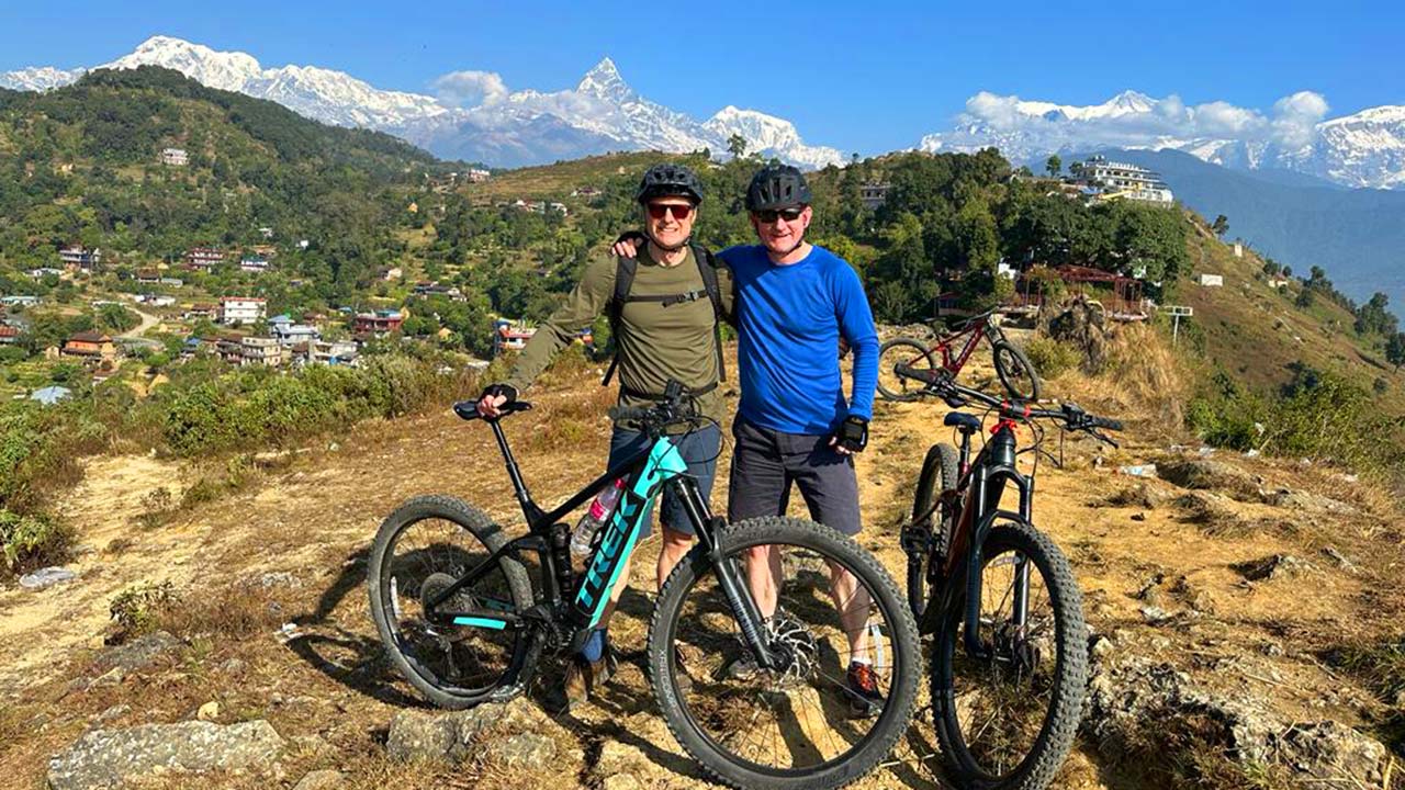 E-MTB riders with the backdrop of Annapurna Himalayan range captured in a frame during E-MTB tour in Nepal.