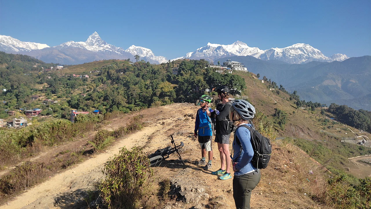 Mountain bikers are enjoying the beautiful view.